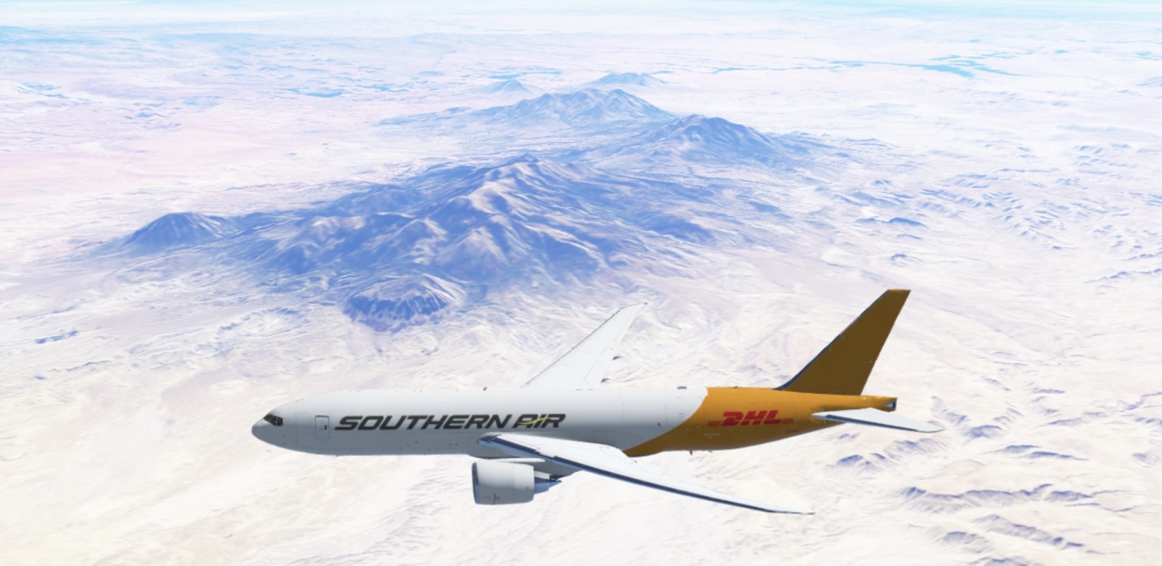 DHL Southern Air Boeing 777F cruising over mountains